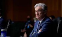 Fed Holds Interest Rates Near Zero, Boosts Economic Projections