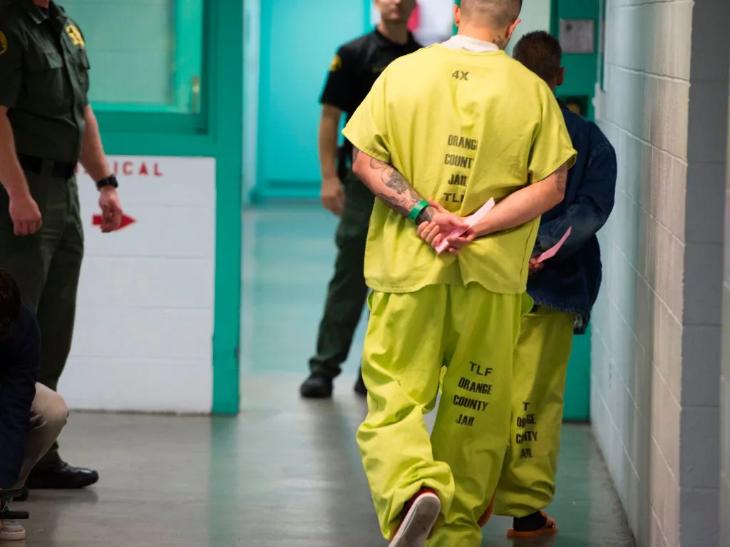 Immigration detainees walk down a hall at the Orange County's Theo Lacy Facility in Orange, Calif., on March 14, 2017. (Robyn Beck/AFP via Getty Images)