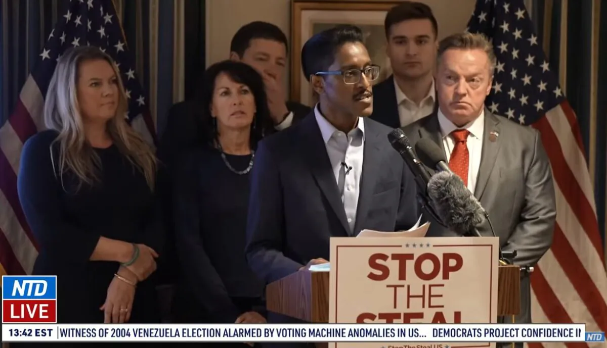 Ali Alexander, director of the "Stop the Steal" movement, speaks during a press conference in Washington on Dec. 15, 2020. Among those with him are Michigan GOP electors Meshawn Maddock and Marian Sheridan. (NTD Television)