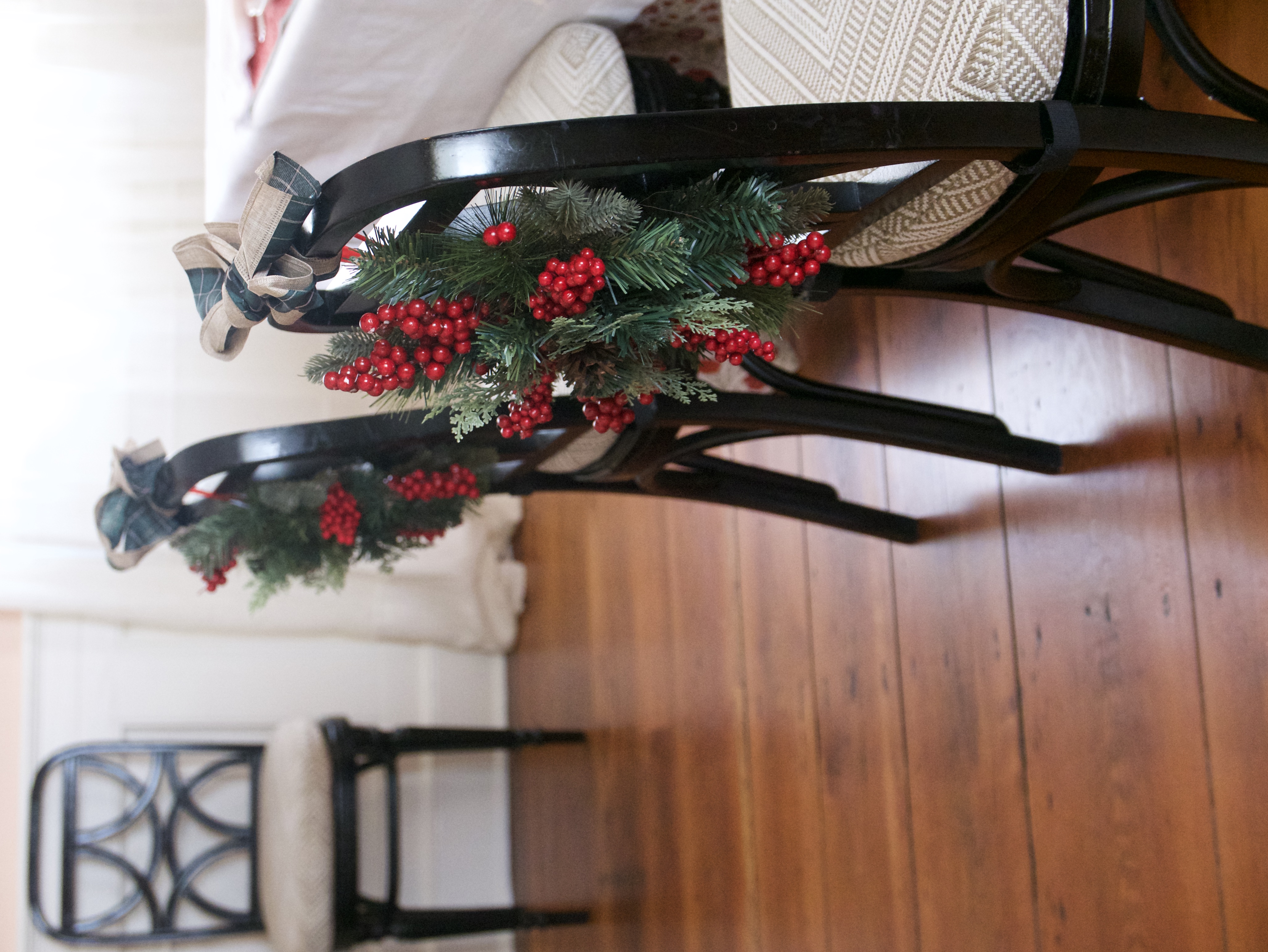 wreaths on backs of chairs