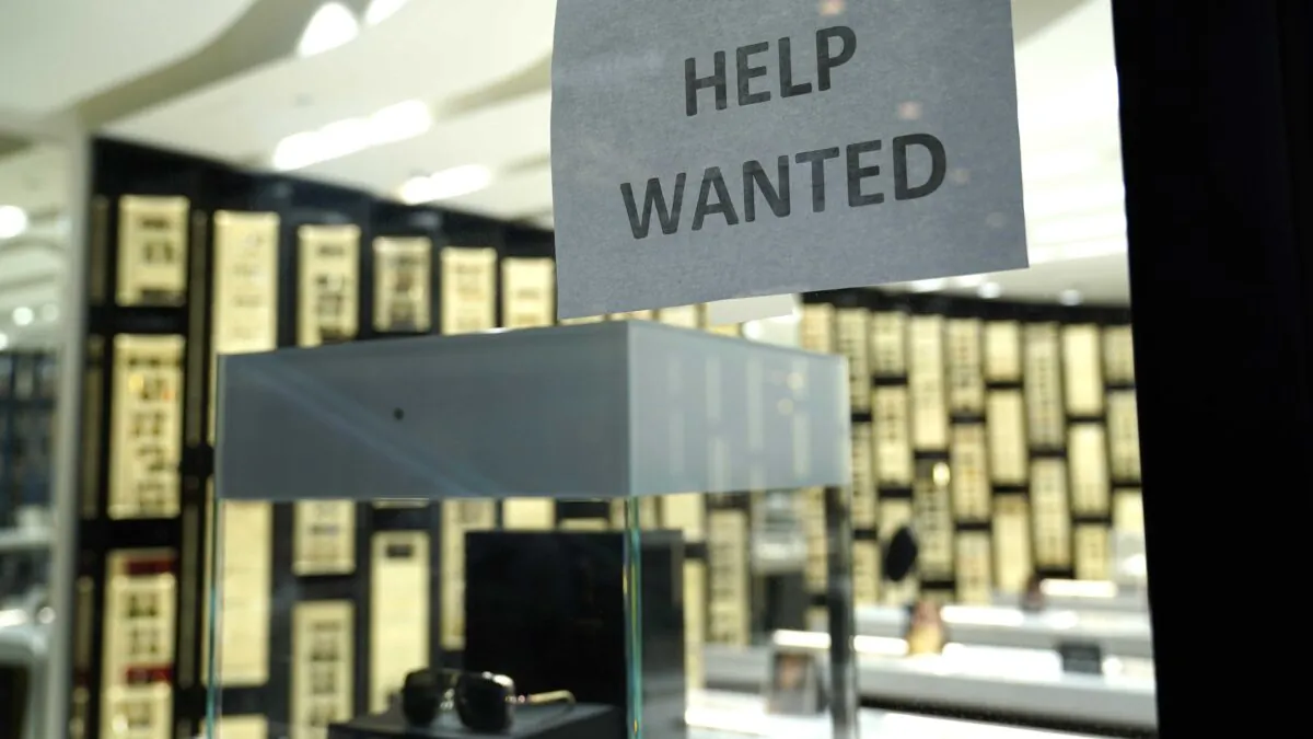 A Help Wanted sign is posted at a Designer Eyes store at Brickell City Centre in Miami, on Nov. 6, 2020. (Lynne Sladky/AP Photo)