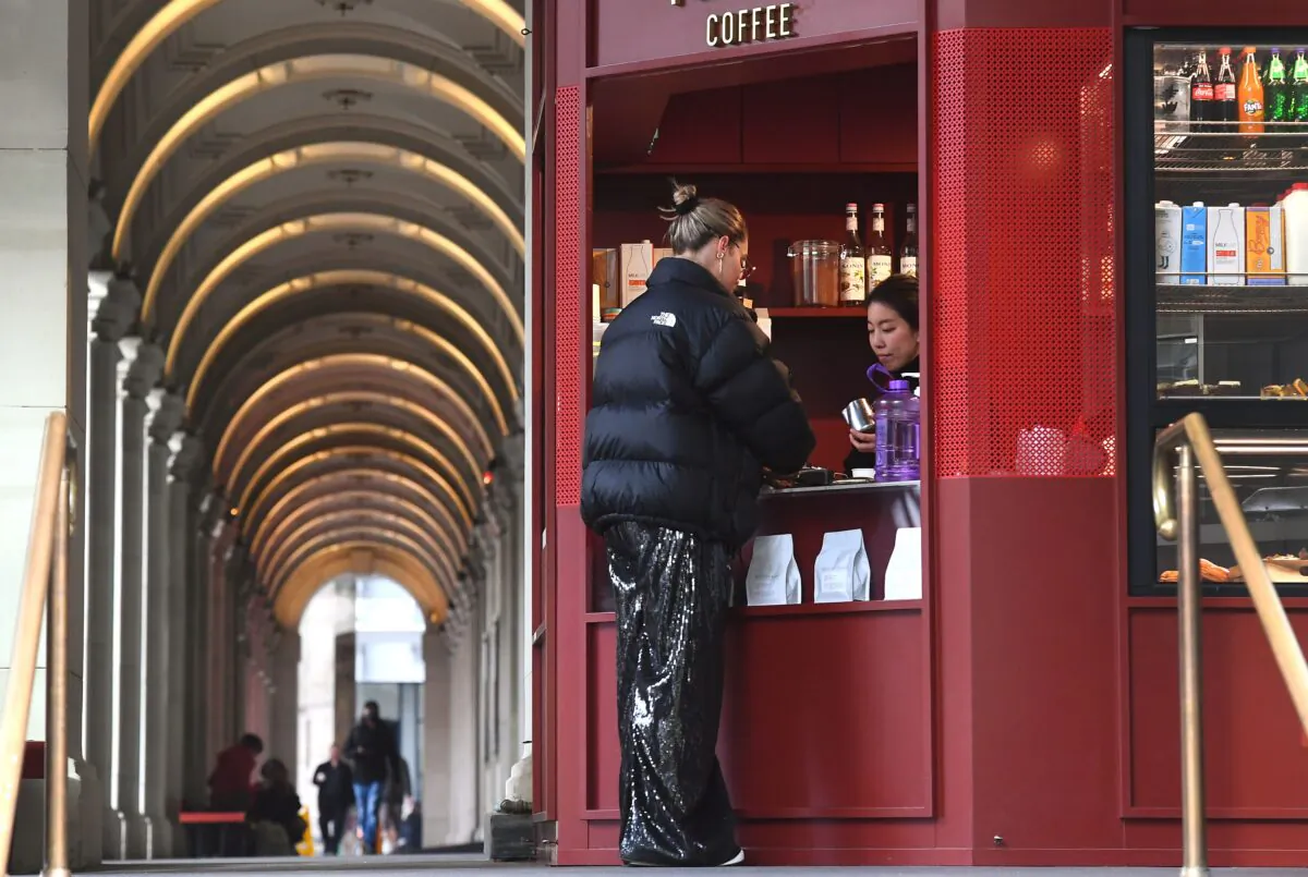 A woman orders coffee at the Bourke Street mall in Melbourne on July 10, 2020,(William West/AFP via Getty Images)