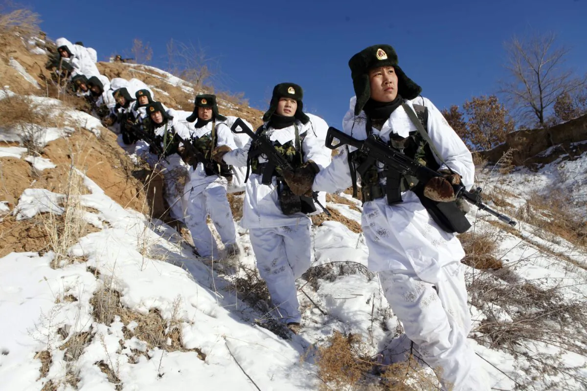 Soldiers take part in a winter training session in freezing temperatures in Heihe, northeast China, on Jan. 28, 2015. (STR/AFP via Getty Images)