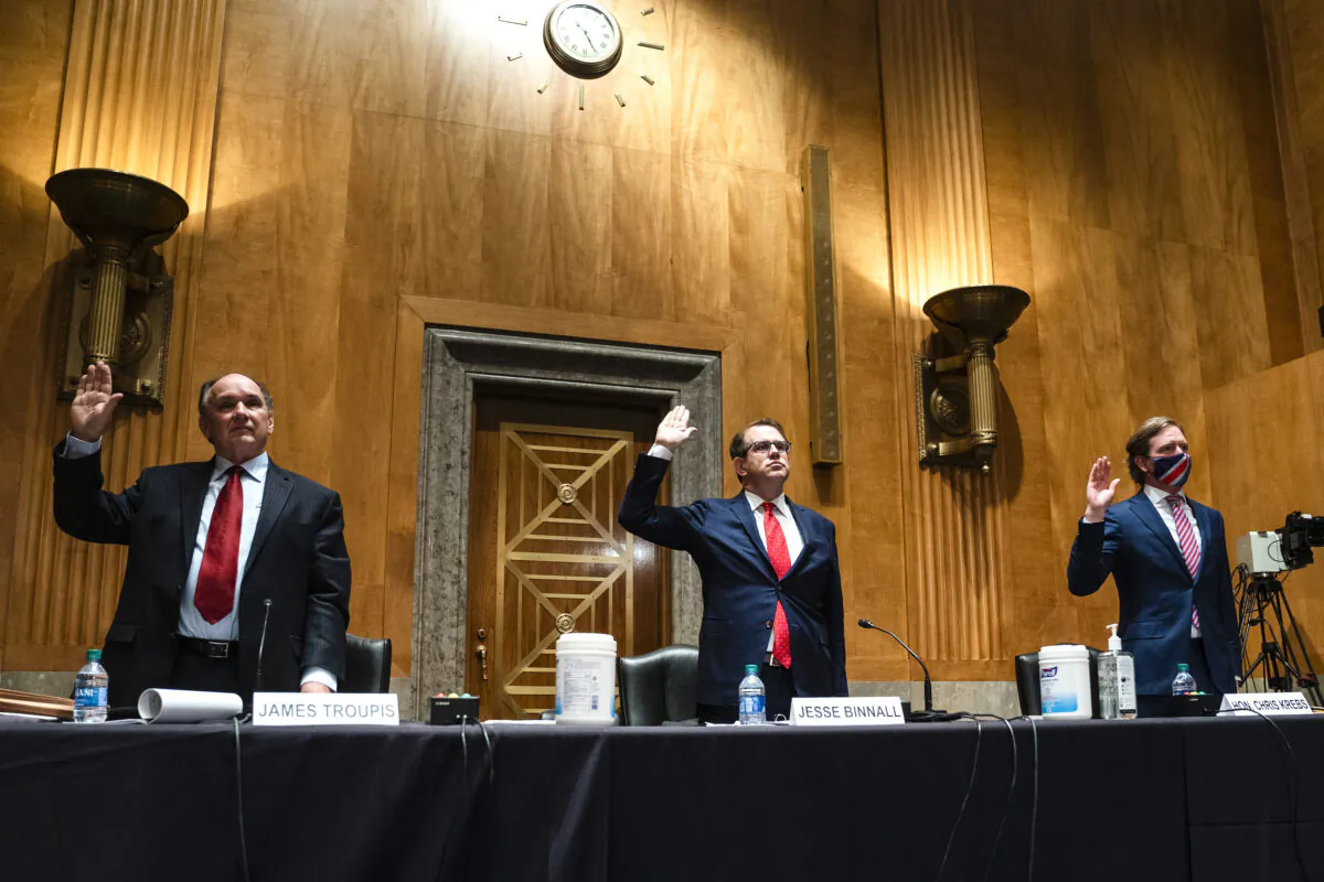 Trump campaign attorneys James R. Troupis (L), and Jesse Binnall (C), and former Cybersecurity and Infrastructure Security Agency Director Chris Krebs (R) are sworn in prior to testifying before a Senate Homeland Security and Governmental Affairs hearing to examine claims of voter irregularities in the 2020 election in the Dirksen Senate Office Building in Washington, on Dec. 16, 2020. (Jim Lo Scalzo-Pool/Getty Images)