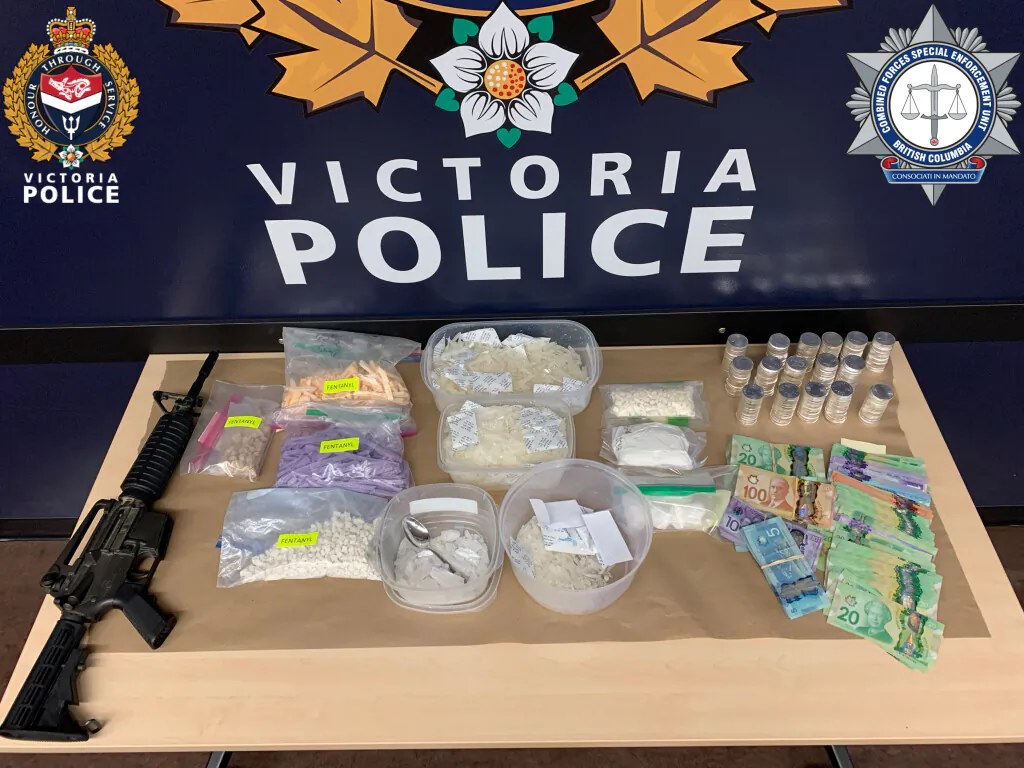 Replica rifle, fentanyl, other drugs, and cash that were seized in Operation Juliet in a file photo. (Victoria Police Handout)