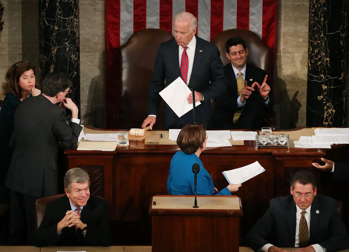 House Speaker Paul Ryan (R-Wis.), top right, reacts as Vice President Joe Biden, center top, presides over the counting of the electoral votes from the 2016 presidential election during a joint session of Congress in Washington on Jan. 6, 2017. (Mark Wilson/Getty Images)