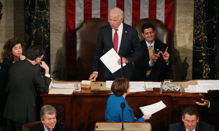 House Speaker Paul Ryan (R-Wis.), top right, reacts as Vice President Joe Biden, center top, presides over the counting of the electoral votes from the 2016 presidential election during a joint session of Congress in Washington on Jan. 6, 2017. (Mark Wilson/Getty Images)
