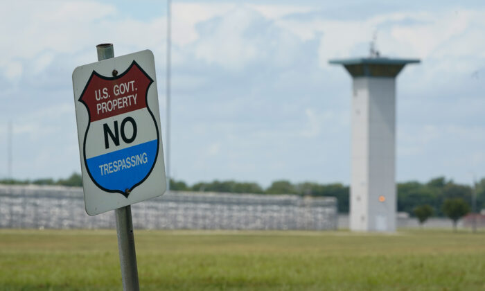A no trespassing sign is displayed outside the federal prison complex in Terre Haute, Ind., on Aug. 28, 2020. (Michael Conroy/AP Photo)