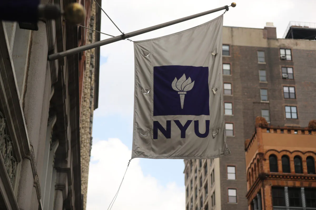 A New York University (NYU) flag flies outside the NYU business school in New York City, N.Y., on Aug. 25, 2020. (Spencer Platt/Getty Images)