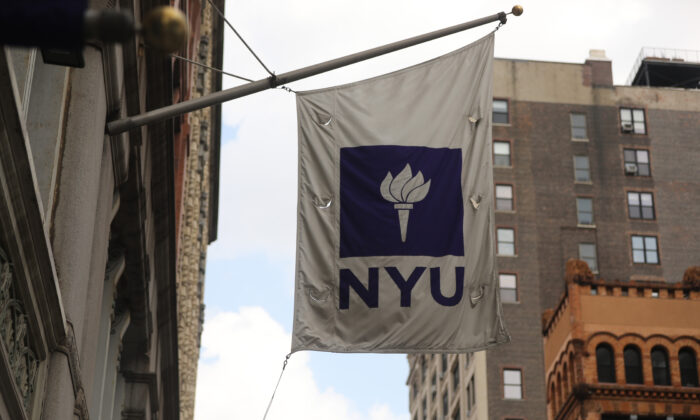 A New York University (NYU) flag flies outside the NYU business school in New York City, N.Y., on Aug. 25, 2020. (Spencer Platt/Getty Images)