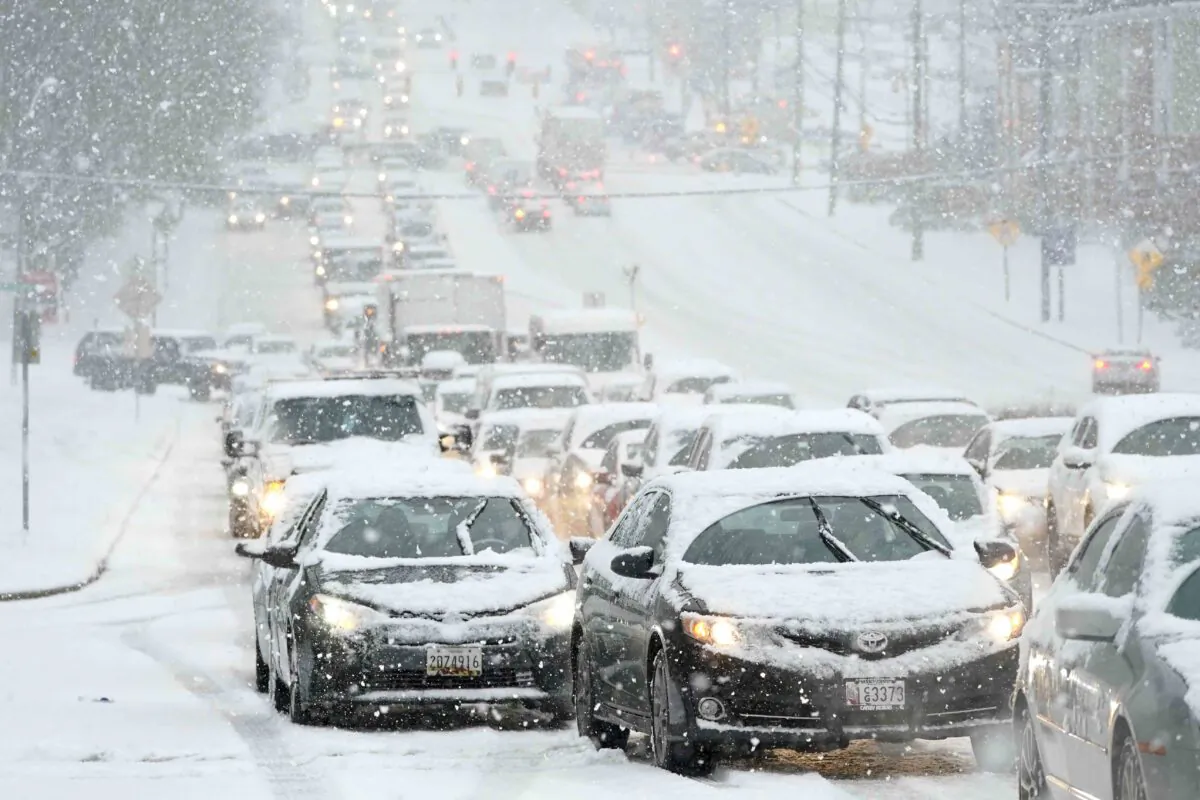 A traffic jam is caused by vehicles stuck on a hill during a snowstorm in Towson, Md., on Dec. 16, 2020. (AP Photo/Julio Cortez)