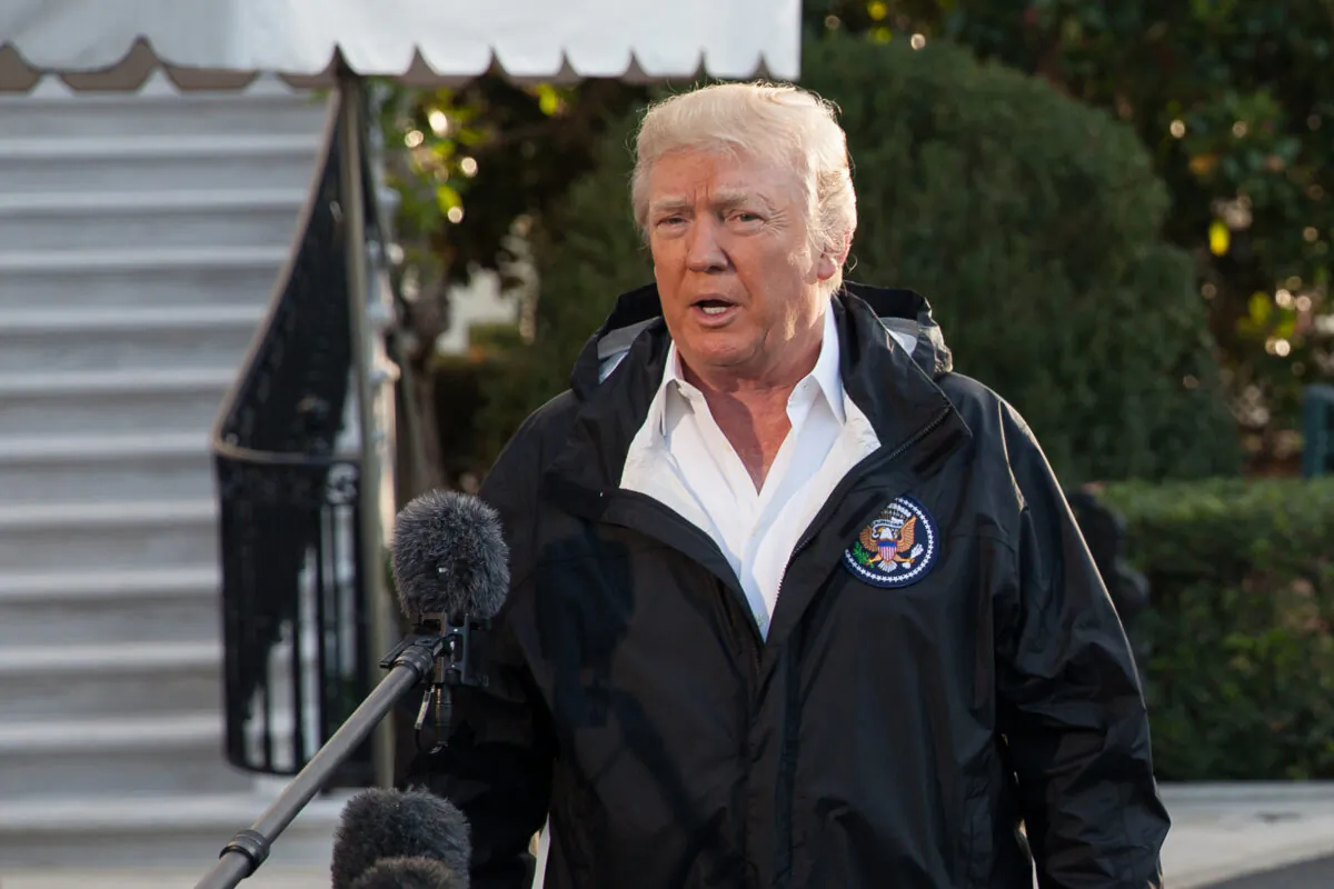 President Donald Trump speaks with the press before boarding Marine One with First Lady Melania Trump on the South Lawn of the White House on Oct. 3, 2017, en route to Puerto Rico. (Samira Bouaou/The Epoch Times)