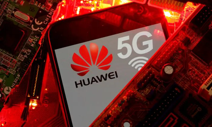 A smartphone with the Huawei and 5G network logo is seen on a PC motherboard in this illustration picture taken on Jan. 29, 2020. (Dado Ruvic/Reuters)