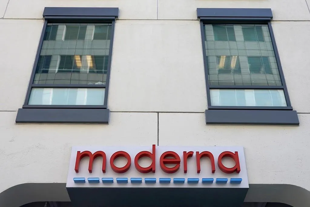 The facade of Moderna, Inc. headquarters is seen on Dec. 15, 2020, in Cambridge, Mass. (AP Photo/Elise Amendola)