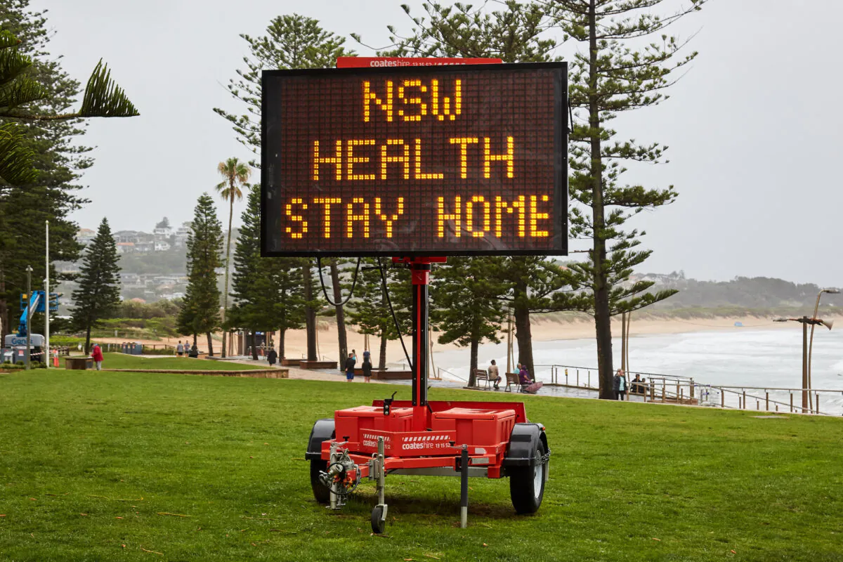 A Covid-19 digital sign is seen on Dee Why beachfront in Sydney, Australia on Dec. 19, 2020. (Lee Hulsman/Getty Images)