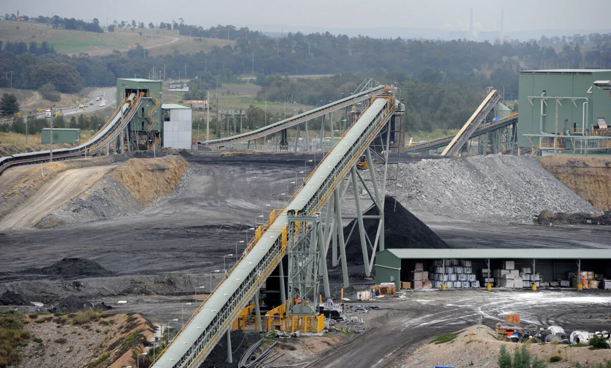 Surface operations process rock from the Ashton open cut coal mine near Camberwell in the Hunter Valley, Australia on Aug. 30, 2011. (TORSTEN BLACKWOOD/AFP via Getty Images)