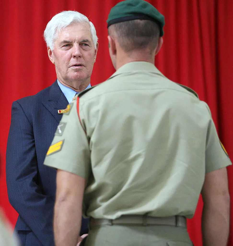 Governor-General Michael Jeffery (L) speaks with Australian Army Commando Corporal "B" (R) during a ceremony to present him with the Medal Of Gallantry at the Holsworthy Barracks in the outer south-western suburbs of Sydney, 26 November 2006. (TROY BENDEICH/Getty Images)