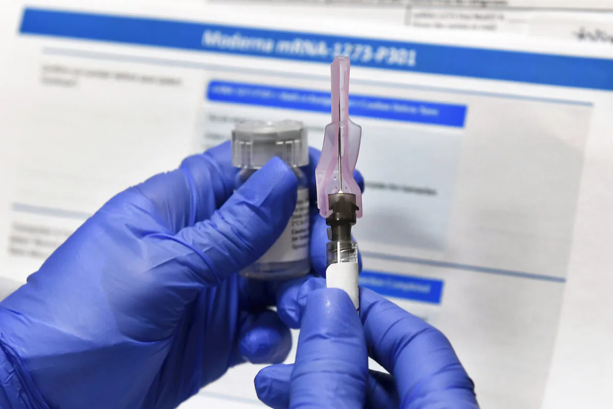 A nurse prepares a shot of a COVID-19 vaccine candidate developed by the National Institutes of Health and Moderna, in Binghamton, N.Y., on July 27, 2020. (Hans Pennink/AP Photo)