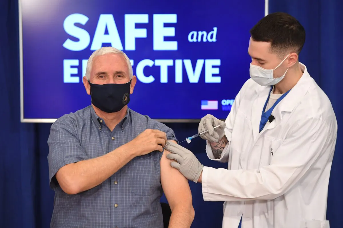 Vice President Mike Pence receives the COVID-19 vaccine in the Eisenhower Executive Office Building in Washington on Dec. 18, 2020. (Saul Loeb/AFP via Getty Images)