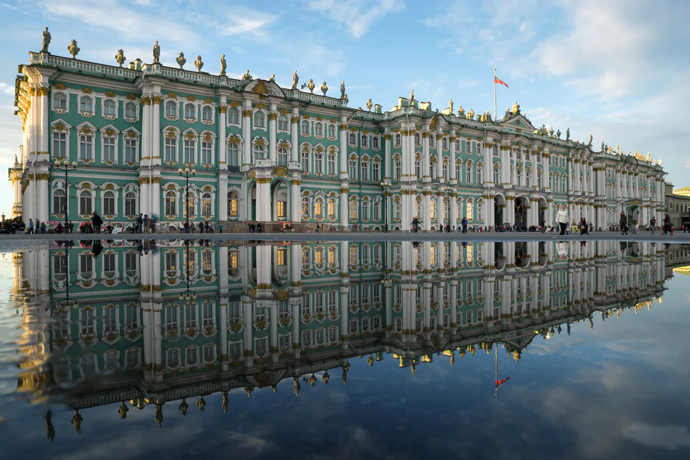 The Baroque-style Winter Palace in St. Petersburg, Russia, is reflected in a puddle on Palace Square. (Roman Sibiryakov/Shutterstock.com)