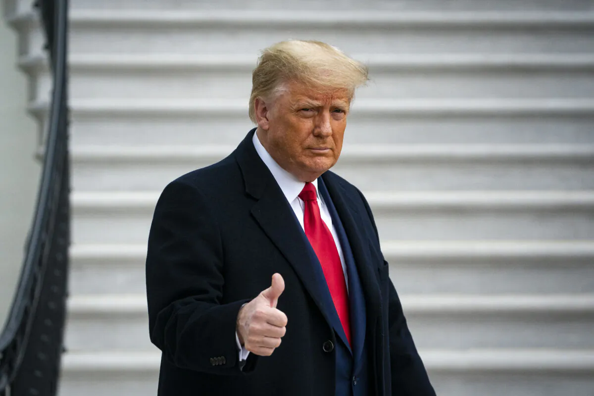 President Donald Trump gives a thumbs up as he departs on the South Lawn of the White House, in Washington on Dec. 12, 2020. (Al Drago/Getty Images)