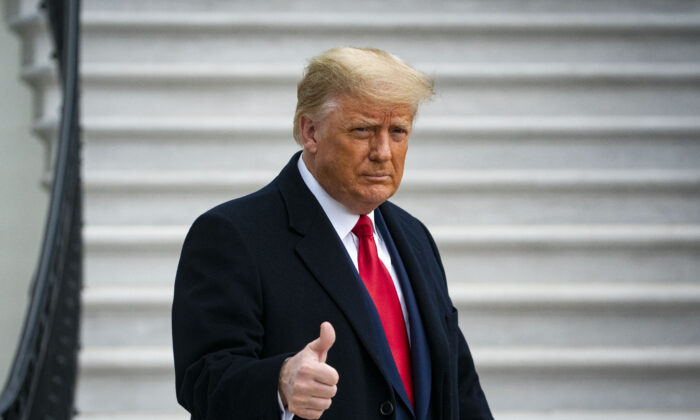 President Donald Trump gives a thumbs up as he departs on the South Lawn of the White House, in Washington on Dec. 12, 2020. (Al Drago/Getty Images)