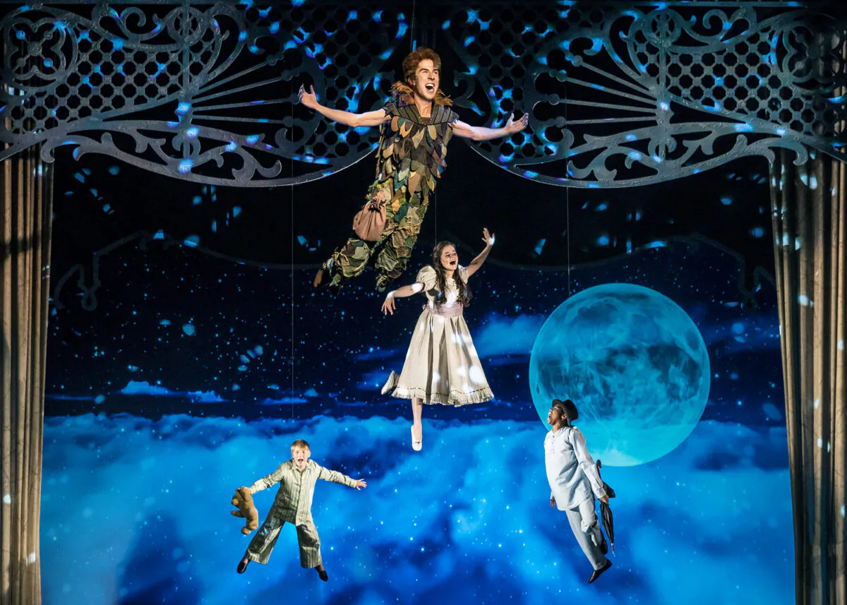 Peter Pan (Johnny Shea, top) leads the Darling siblings (left to right, Carter Graf, Elizabeth Stenholt, and Cameron Goode) on a high-flying adventure to Neverland in “Peter Pan, A Musical Adventure,” streaming free on-demand for the holiday season. (Liz Lauren)