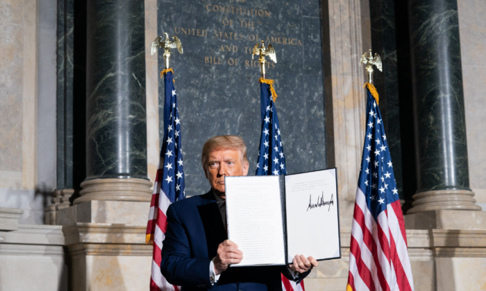 President Donald J. Trump signs the Constitution Day, Citizenship Day, and Constitution Week 2020 Proclamation Thursday, Sept. 17, 2020, during the White House Conference on American History at the National Archives and Records Administration in Washington, D.C. (Joyce Boghosian/White House)