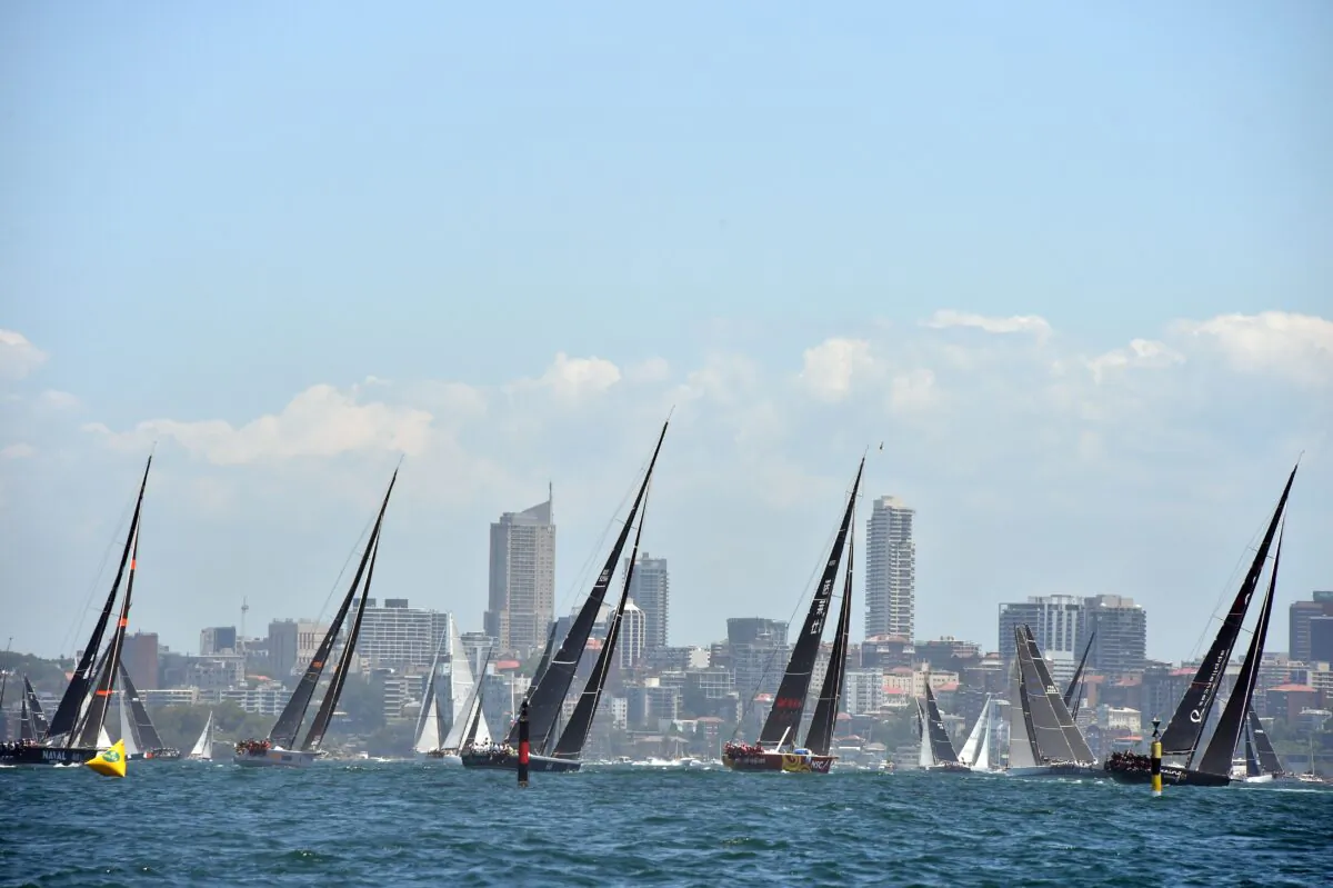 Yachts sail out of Sydney Harbour at the start of the Sydney to Hobart yacht race on Dec. 26, 2018. (Peter Parks/ AFP)