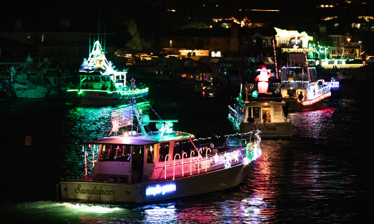 Boats decorated with lights participate in the 'Unofficial' Newport Harbor Christmas Boat Parade in Newport Beach, Calif., on Dec. 17, 2020. (John Fredricks/The Epoch Times)