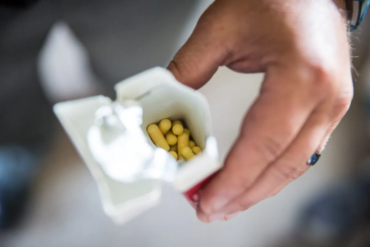 A cigarette box of pills that was found with two people in an abandoned home in Dayton, Ohio, is seen in a Aug. 3, 2017, file photograph. (Benjamin Chasteen/The Epoch Times)