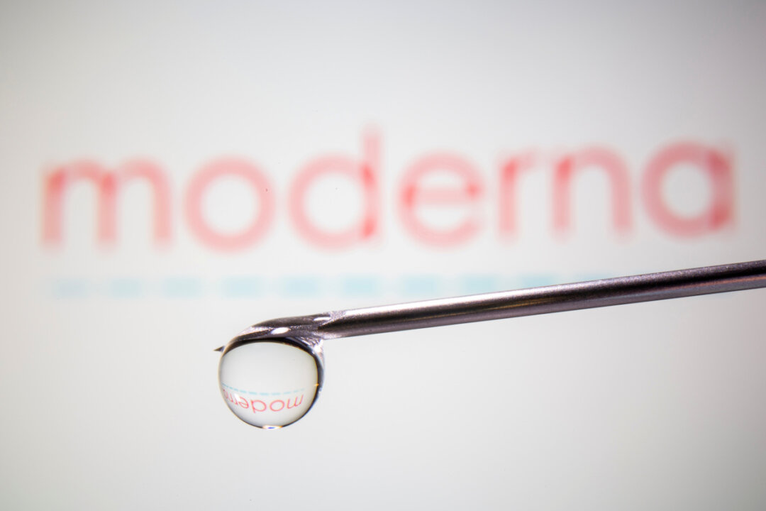 Moderna's logo is reflected in a drop on a syringe needle in this illustration taken Nov. 9, 2020. (Dado Ruvic/Illustration/Reuters)