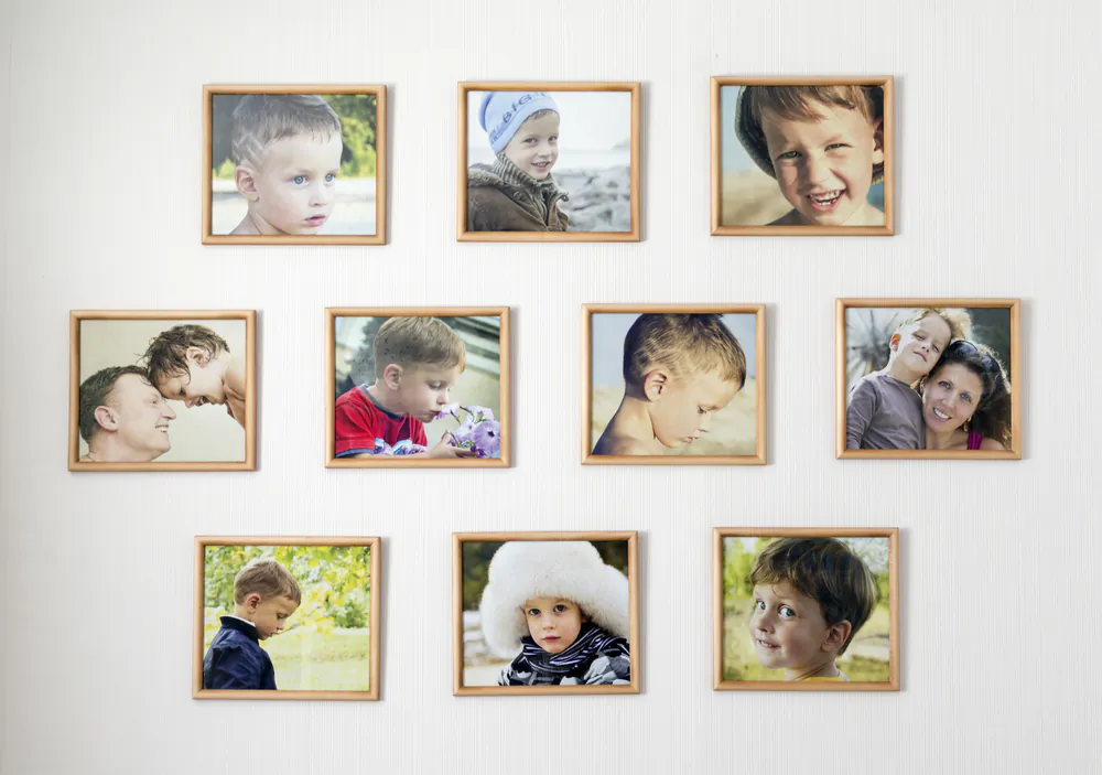 Framed family photos add a familiar, homey touch. (ForGaby/Shutterstock)