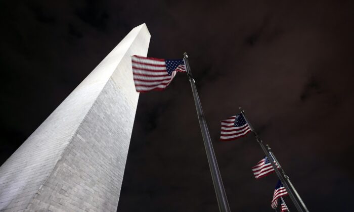 American flags fly around the Washington Monument in Washington on Dec. 18, 2020. (Manuel Balce Ceneta/AP Photo)