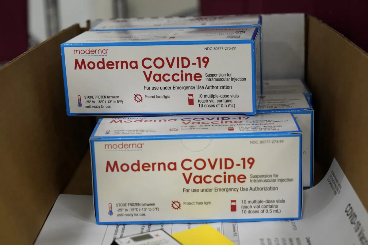 Boxes containing the Moderna COVID-19 vaccine are prepared to be shipped at the McKesson distribution center in Olive Branch, Miss., on Dec. 20, 2020. (Paul Sancya/AP Photo, Pool)