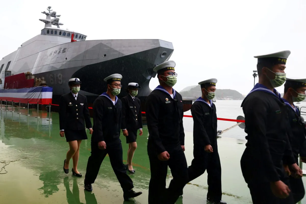 Navy officers march during the official ceremony for the new Tuo Chiang-class corvettes in Yilan, Taiwan, on Dec.15, 2020. (Ann Wang/Reuters)
