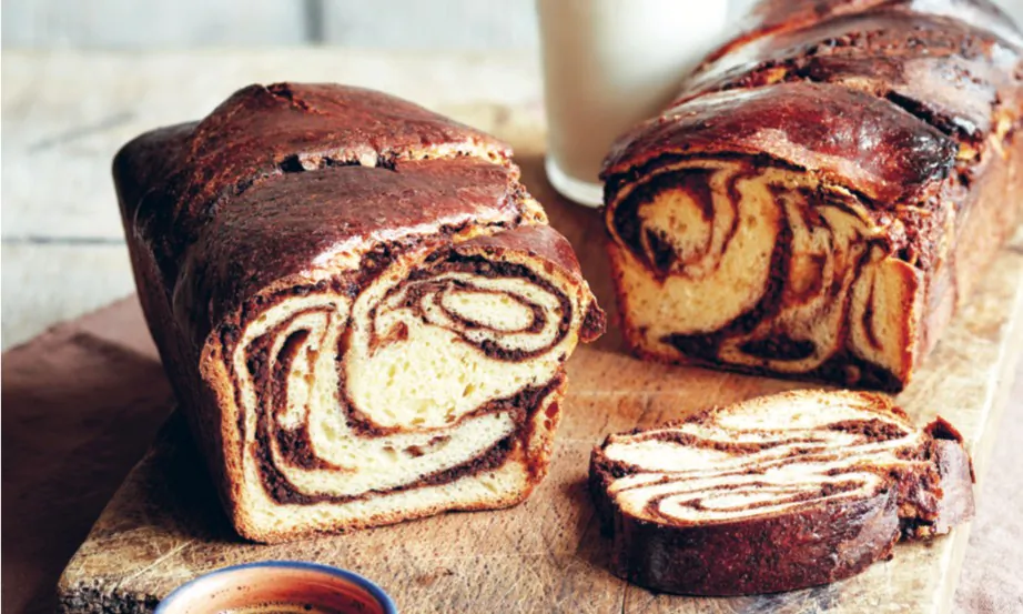 Traditional Romanian cozonac features a dough rich with butter, milk, and eggs; perfumed with lemon zest and vanilla; and swirled with a bittersweet walnut and rum filling. (Jamie Orlando Smith)
