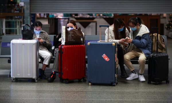 Travellers with they suitcases