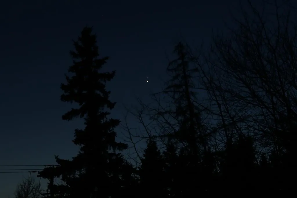 During a holiday season that due to the global pandemic is unlike any other, astronomers and ordinary Canadians will look skyward Monday evening for a celestial event dubbed "The Christmas Star" which hasn't been so brilliant for close to eight centuries. The planets Saturn and Jupiter are seen in the night sky from Edmonton, on Dec. 20, 2020. (The Canadian Press/HO-Brian Martin)