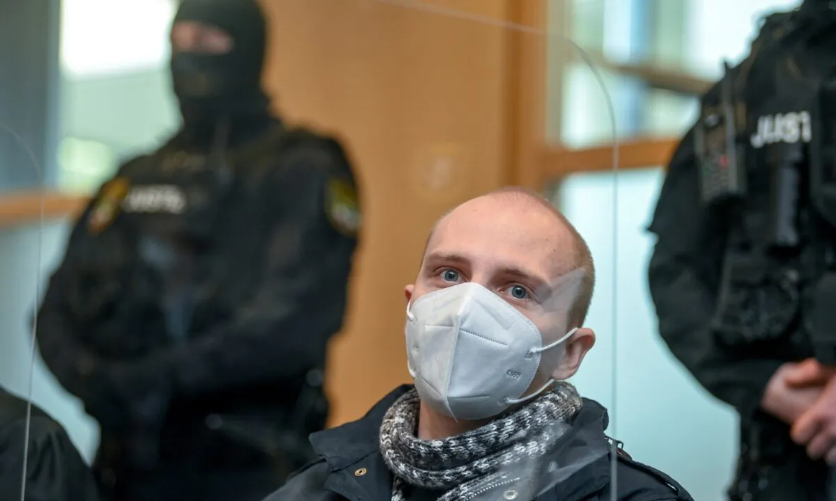 The defendant Stephan Balliet sits in the courtroom of the district court on the 26th day of the trial before the court's verdict in Magdeburg, Germany, on Dec. 21, 2020. (Hendrik Schmidt/Pool via AP)