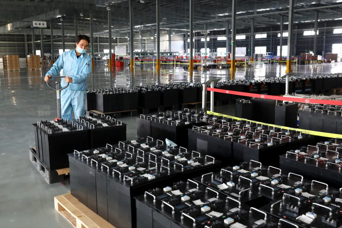 An employee in the workshop of a lithium battery manufacturing company in Huaibei, eastern China's Anhui province on Nov. 14, 2020. (STR/AFP via Getty Images)