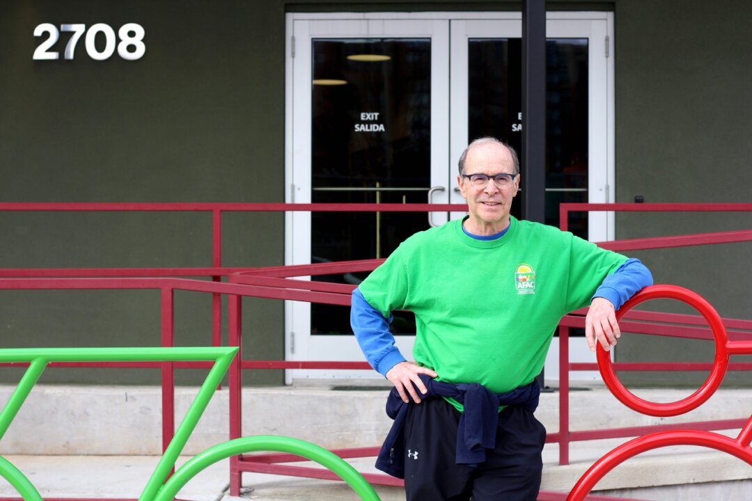“I’m volunteering more,” was writer Bruce Horovitz’s reply when his doctor asked what he’d been doing to cause a dramatic improvement in his health. Before the COVID-19 pandemic struck, Horovitz had increased his volunteering from one day a week to three days a week, including doing food distribution at the Arlington Food Assistance Center in Arlington, Virginia. But he stopped that in March and says he misses it. (Lynne Shallcross/KHN)