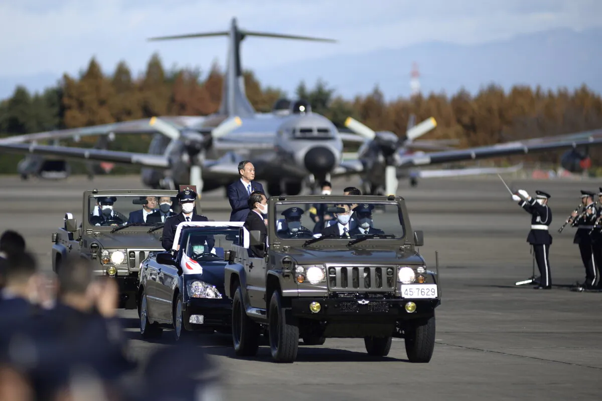 Japanese Prime Minister Yoshihide Suga reviews Japan's Air Self-Defense Force at Iruma Air Base in Sayama, Saitama Prefecture, Japan, on Nov. 28, 2020. (David Mareuil/File Photo/Pool via Reuters)