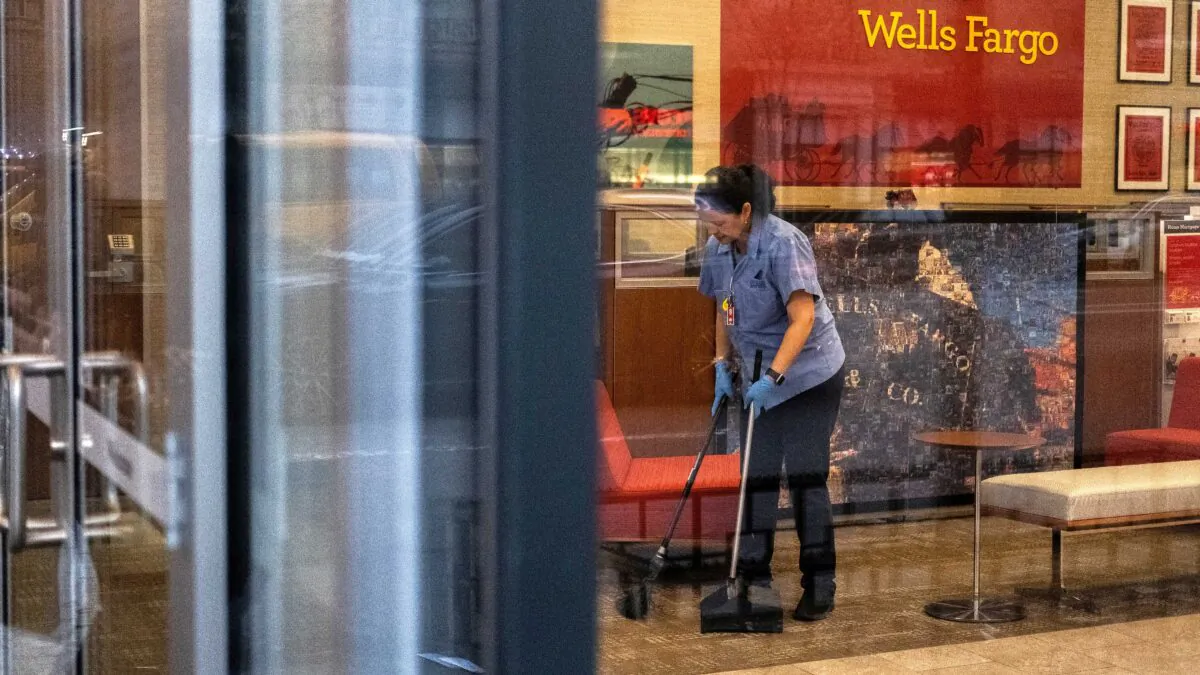A staff cleans the lobby inside Wells Fargo bank in New York City on March 17, 2020. (Jeenah Moon/Reuters)