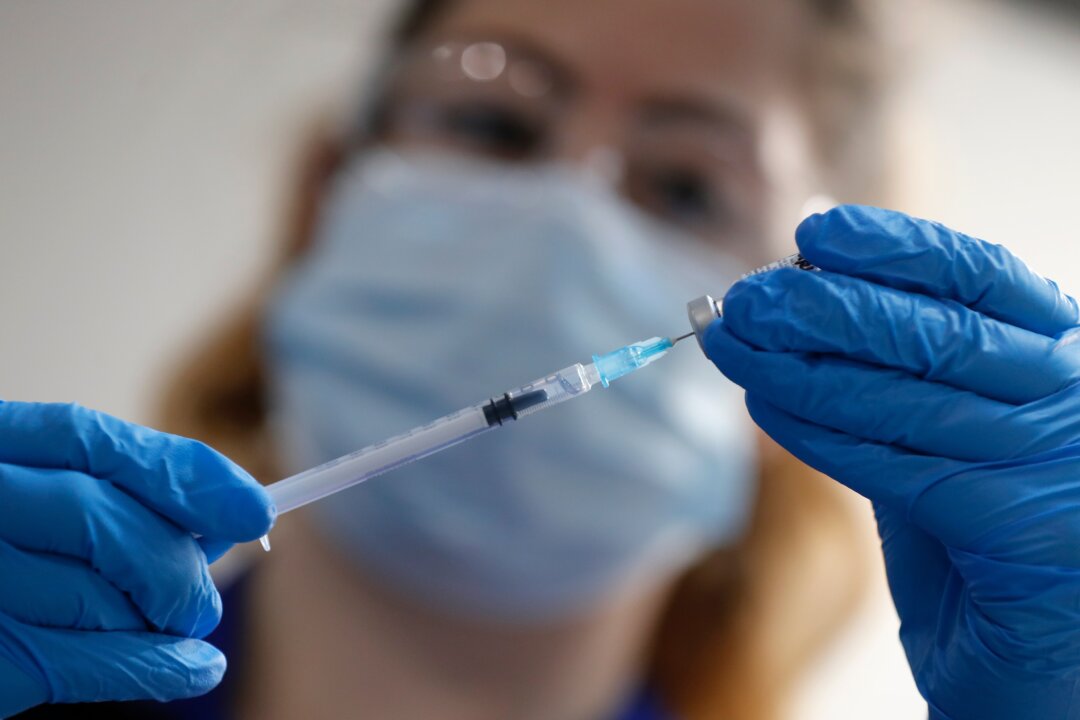 A nurse prepares to administer the Pfizer-BioNTech COVID-19 vaccine at Guy's Hospital in London, UK, on Dec. 8, 2020. (Frank Augstein/AP Photo)