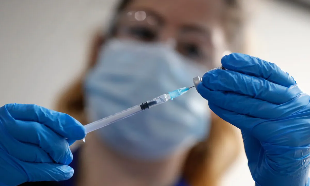 A nurse prepares to administer the Pfizer-BioNTech COVID-19 vaccine at Guy's Hospital in London, UK, on Dec. 8, 2020. (Frank Augstein/AP Photo)
