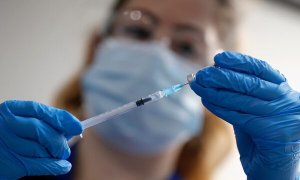 A nurse prepares to administer the Pfizer-BioNTech COVID-19 vaccine