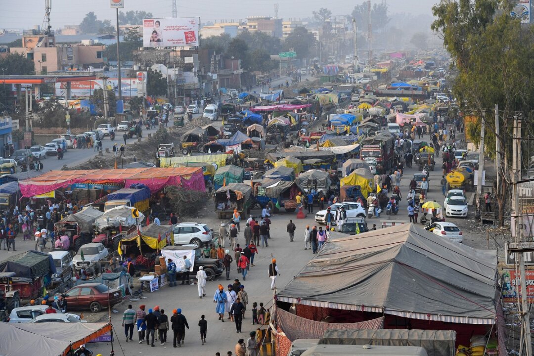 A general view of parked tractor trolleys and trucks of protesting farmers is pictured along a blocked highway during a demonstration against the central government's recent agricultural reforms at the Delhi-Haryana state border in Singhu on December 10, 2020. (Prakash Singh/AFP via Getty Images)