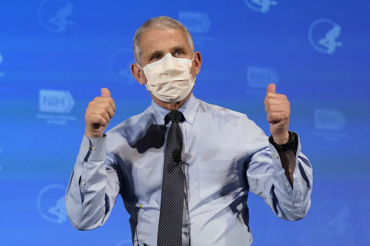 Dr. Anthony Fauci, director of the National Institute of Allergy and Infectious Diseases, gestures after receiving a COVID-19 vaccine, at the National Institutes of Health in Bethesda, Md., on Dec. 22, 2020. (Patrick Semansky/Pool/AFP via Getty Images)