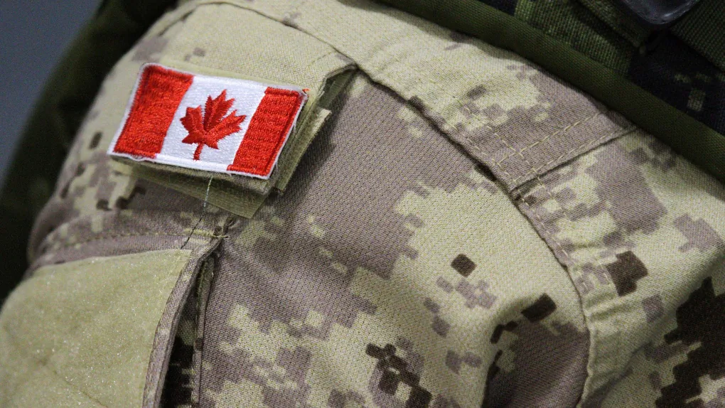A Canadian flag sits on the uniform of a member of the Canadian Armed Forces in this file photo. (The Canadian Press/Lars Hagberg)